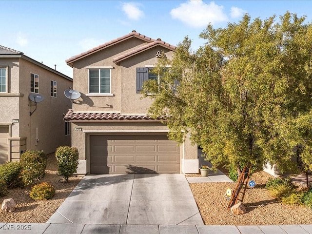 view of front of house with a garage, concrete driveway, a tiled roof, and stucco siding