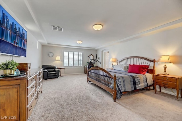 bedroom with carpet, visible vents, and baseboards