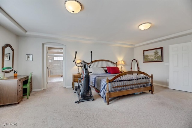 bedroom with light carpet and baseboards