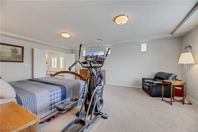 bedroom with carpet floors, visible vents, and baseboards