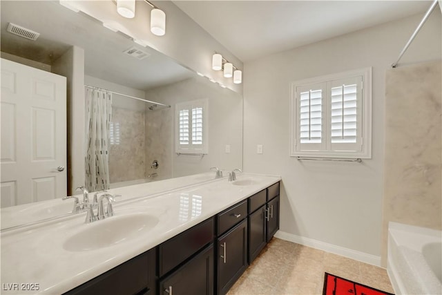 full bathroom with double vanity, visible vents, baseboards, and a sink