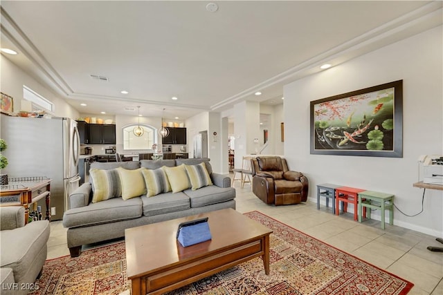 living area with recessed lighting, visible vents, baseboards, and light tile patterned floors