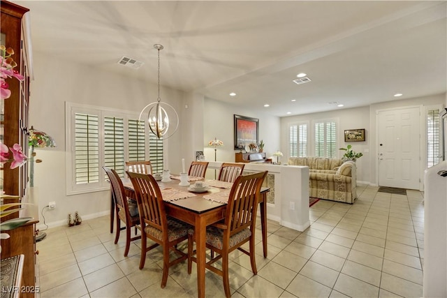 dining space with recessed lighting, visible vents, an inviting chandelier, and light tile patterned flooring