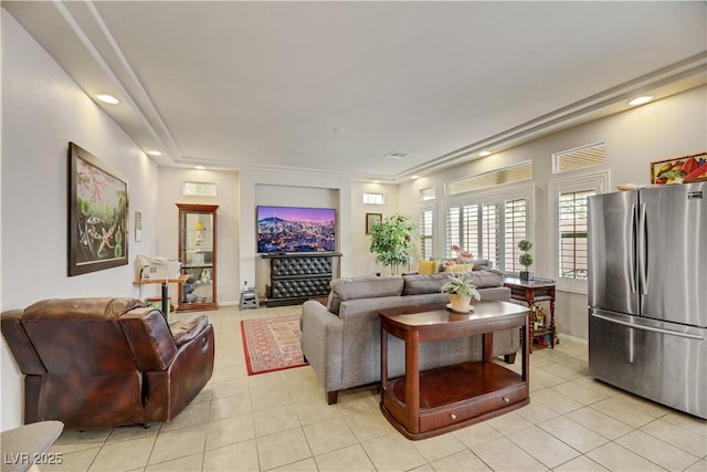 living area featuring recessed lighting, visible vents, baseboards, and light tile patterned flooring