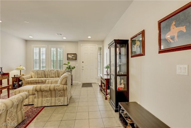 living room featuring recessed lighting, visible vents, and light tile patterned floors