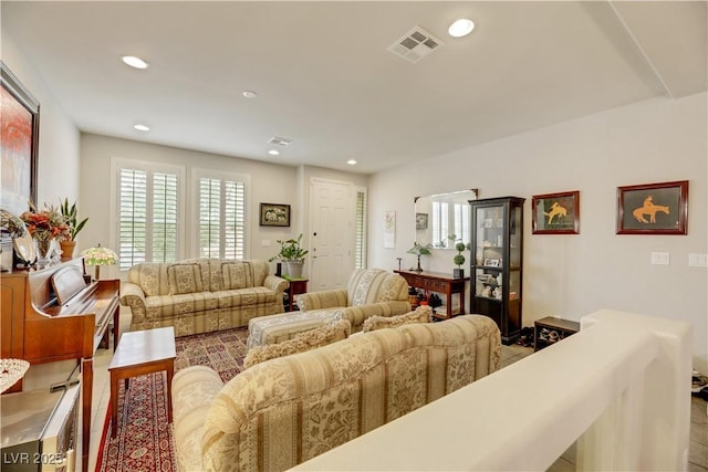 living area with visible vents and recessed lighting