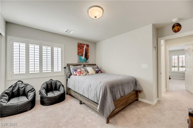 bedroom featuring carpet, visible vents, and baseboards