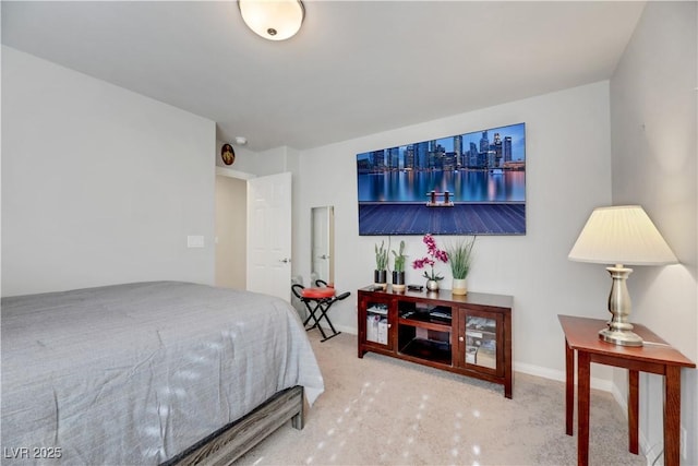 carpeted bedroom featuring baseboards