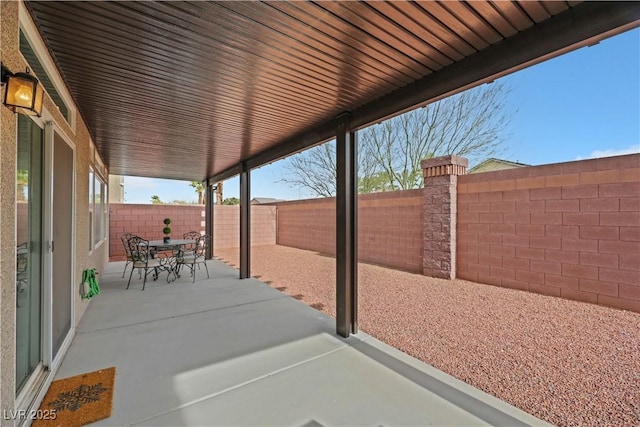 view of patio featuring outdoor dining space and a fenced backyard