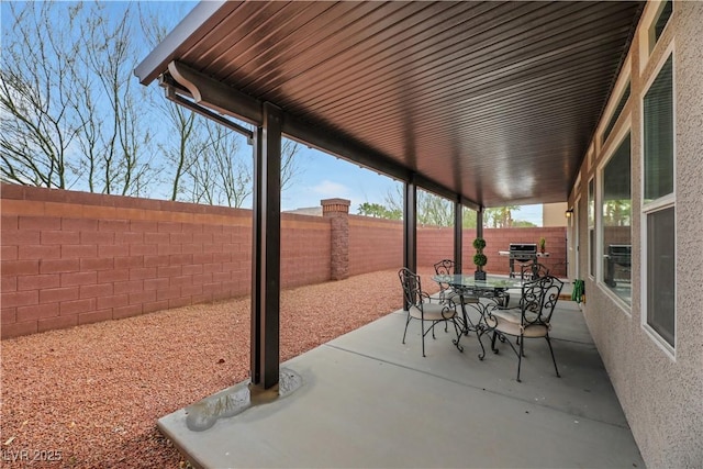 view of patio / terrace featuring a fenced backyard, outdoor dining area, and area for grilling