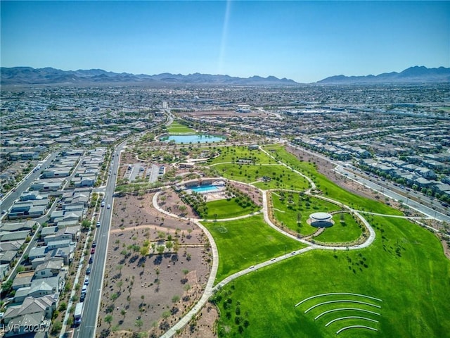 drone / aerial view featuring a water and mountain view