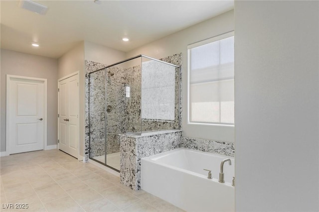 bathroom with tile patterned flooring, a garden tub, recessed lighting, baseboards, and a stall shower