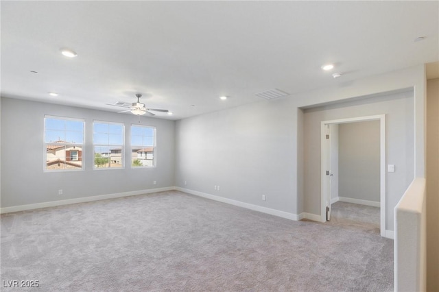 carpeted spare room featuring a ceiling fan, recessed lighting, visible vents, and baseboards