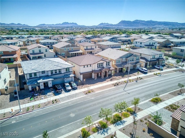 drone / aerial view with a residential view and a mountain view
