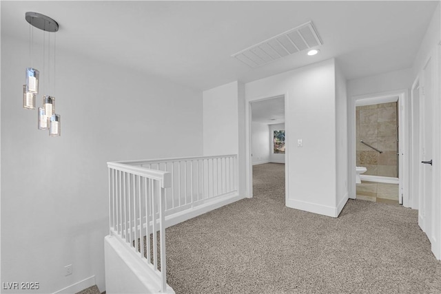 hall with carpet floors, recessed lighting, visible vents, plenty of natural light, and baseboards