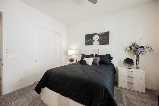 bedroom featuring carpet, baseboards, and a closet