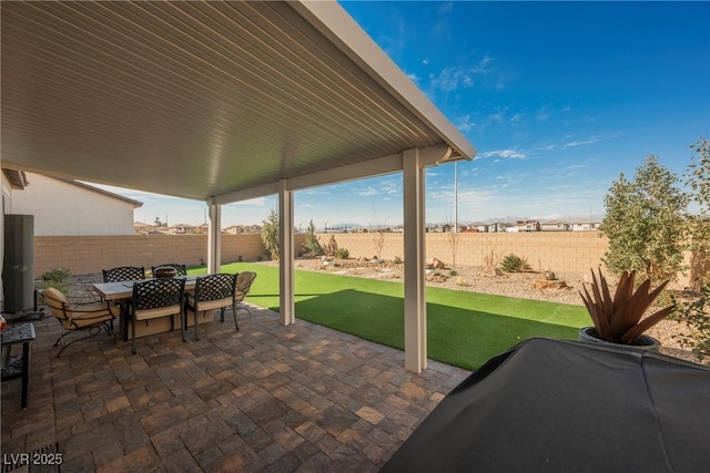 view of patio / terrace featuring outdoor dining area and a fenced backyard