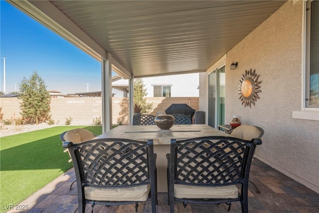 view of patio / terrace with outdoor dining space and a fenced backyard