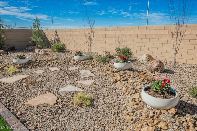 view of yard featuring a fenced backyard