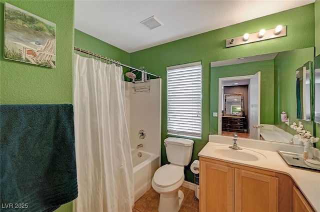 bathroom with a textured wall, toilet, visible vents, vanity, and shower / tub combo with curtain