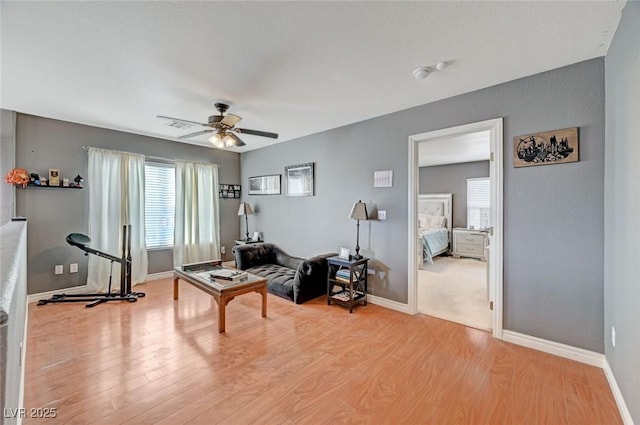 office area with baseboards and light wood-style floors