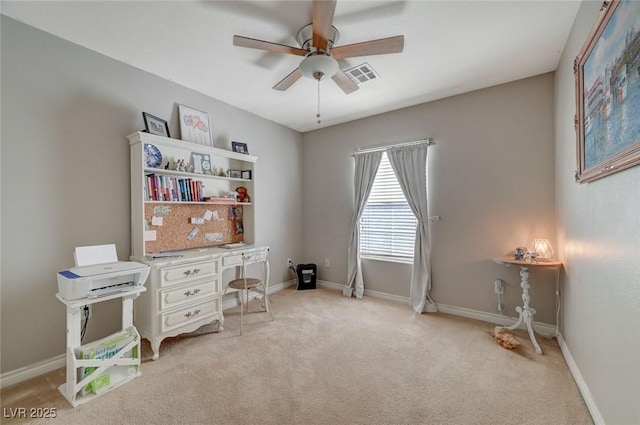 office featuring light carpet, ceiling fan, visible vents, and baseboards