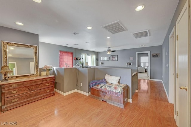 bedroom featuring light wood finished floors, visible vents, and recessed lighting