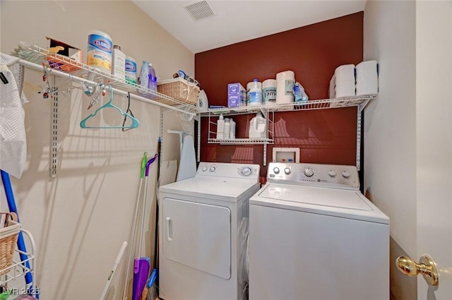 laundry room featuring laundry area, independent washer and dryer, and visible vents