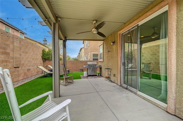 view of patio / terrace with a grill, ceiling fan, and a fenced backyard