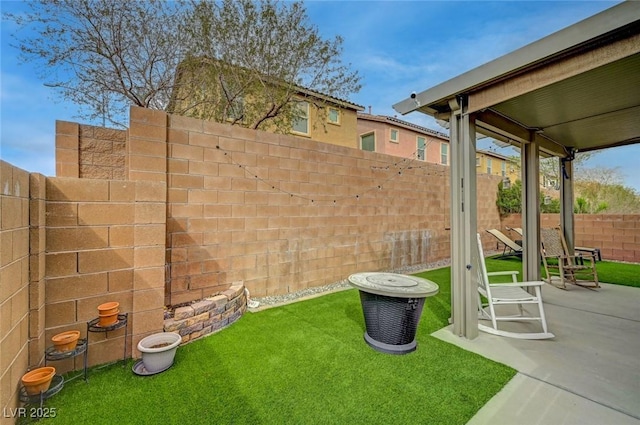 view of yard with a patio area and a fenced backyard