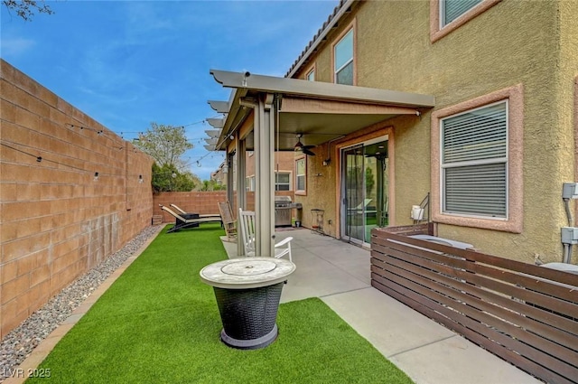 view of yard featuring a patio area and a fenced backyard