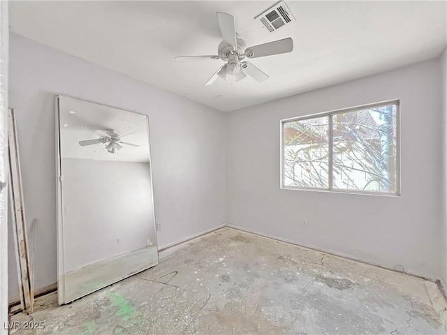 spare room with visible vents and a ceiling fan