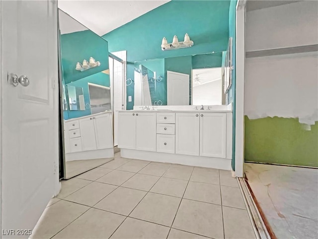 full bath with double vanity, walk in shower, and tile patterned floors