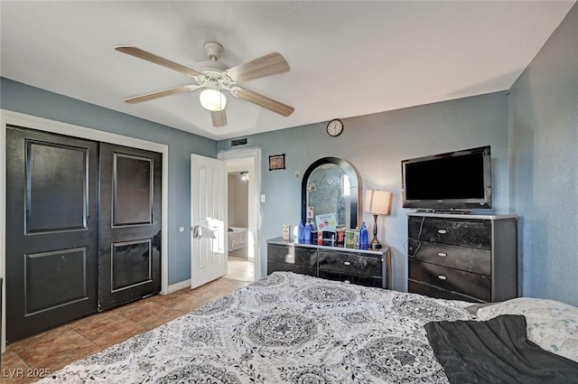 bedroom featuring a ceiling fan and baseboards