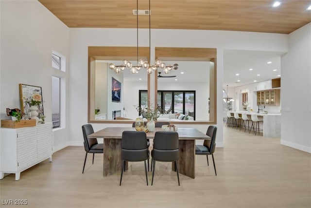 dining space featuring baseboards, visible vents, wooden ceiling, light wood-type flooring, and recessed lighting