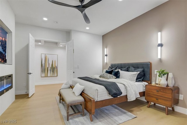 bedroom featuring light wood-style floors, baseboards, a ceiling fan, and recessed lighting