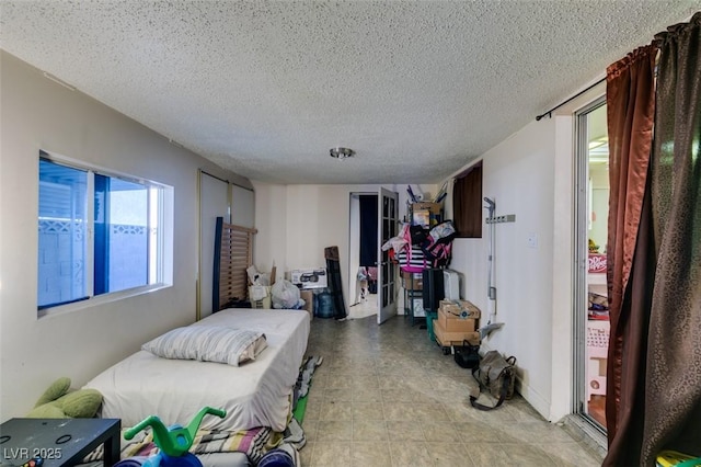 bedroom featuring a textured ceiling