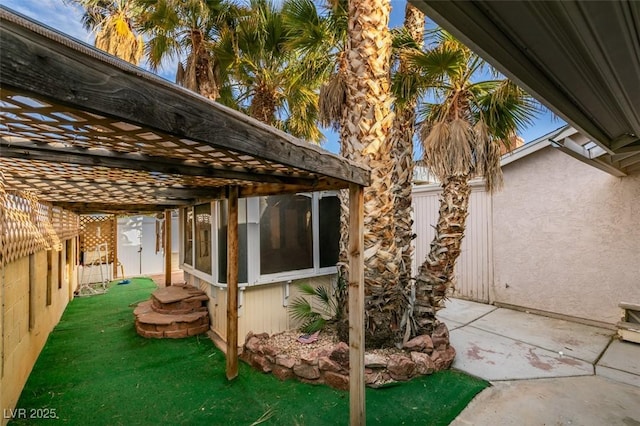 view of patio / terrace featuring fence