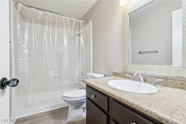 bathroom with shower / bath combo, vanity, toilet, and wood finished floors