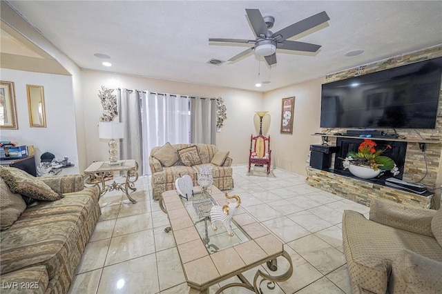 living room with visible vents, a ceiling fan, and recessed lighting