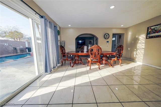 dining area featuring recessed lighting