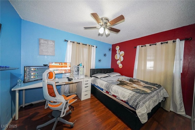 bedroom with ceiling fan, a textured ceiling, and wood finished floors