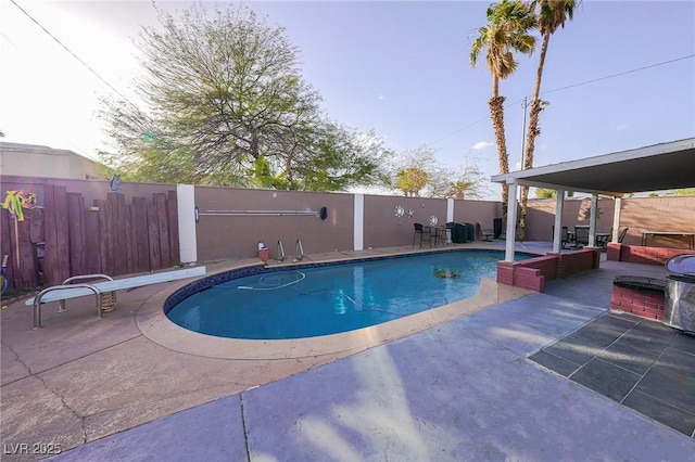 view of pool featuring a fenced in pool, fence private yard, and a patio area