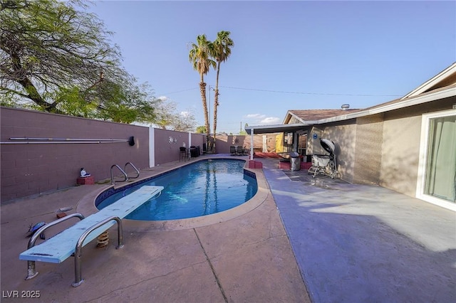 view of pool featuring a patio, a fenced backyard, and a fenced in pool