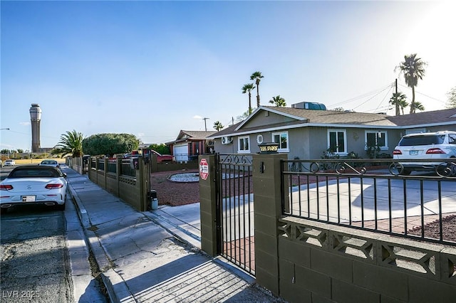 view of gate featuring a fenced front yard