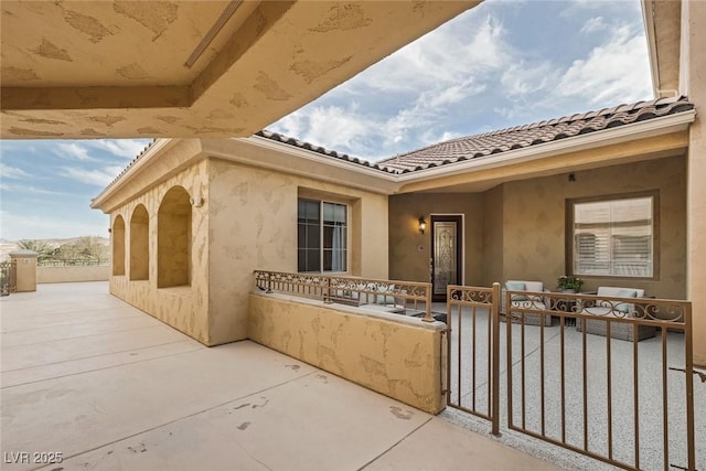 view of patio / terrace featuring fence