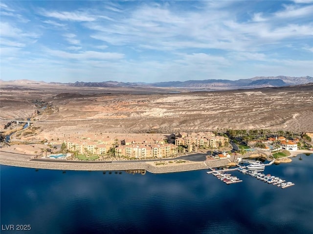 bird's eye view with a water and mountain view