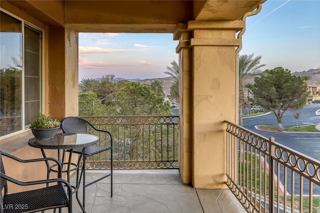 view of balcony at dusk