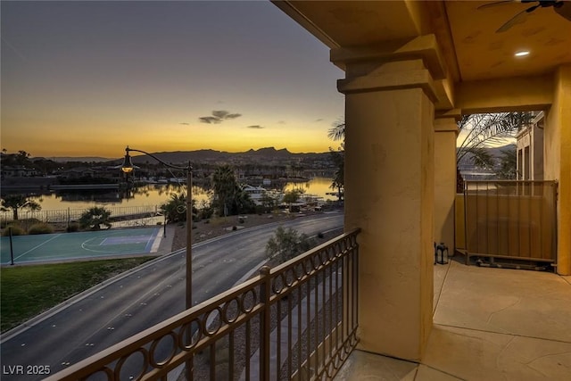 balcony featuring a water view