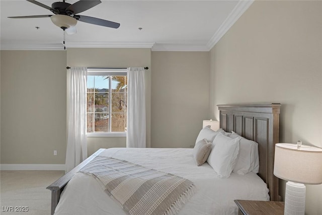 carpeted bedroom featuring baseboards, a ceiling fan, and crown molding